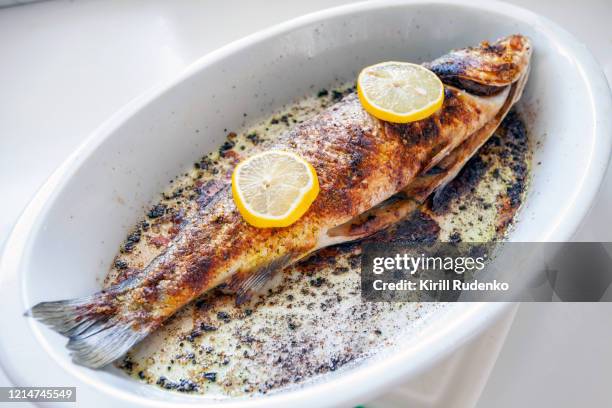 roasted trout on a plate - truta imagens e fotografias de stock