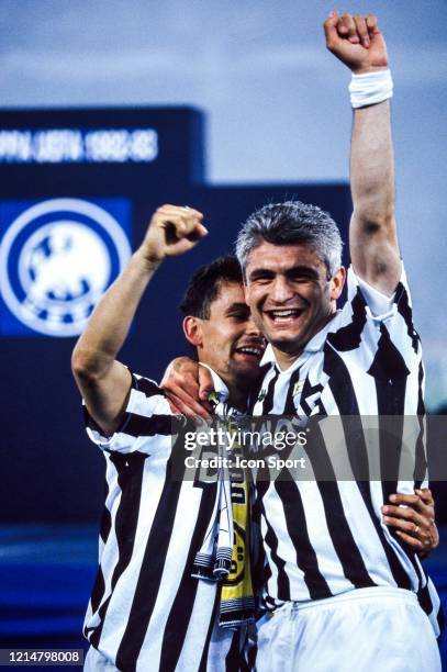 Roberto BAGGIO and Fabrizio RAVANELLI of Juventus celebrate the victory during the UEFA Cup Final, second leg match between Juventus Turin and...