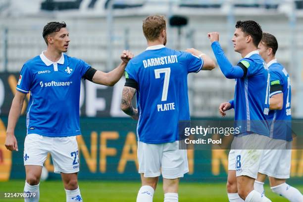 Mathias Honsak of SV Darmstadt 98 celebrates scoring his side's first goal with teammates Felix Platte and Nicolai Rapp during the Second Bundesliga...