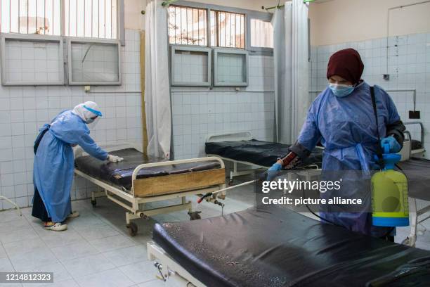 May 2020, Egypt, Giza: A picture made available on 23 May 2020 shows medics disinfecting hospital beds at the 6th Of October Central Hospital, which...