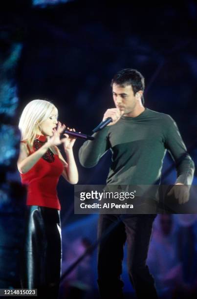 Musicians Christina Aguilera and Enrique Iglesias perform as part of the "A Tapestry Of Nations" Halftim Show of Super Bowl XXXIII on January 30,...