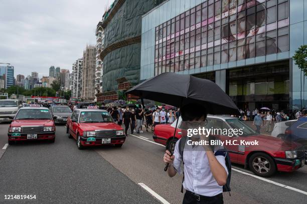 Protesters occupy a road during a protest against a planned national security law in the Causeway Bay district on May 24, 2020 in Hong Kong, China.