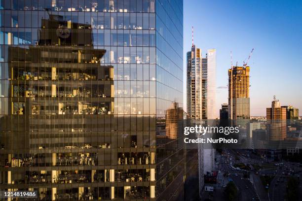 High rise buildings are seen in this aerial photograph in central Warsaw, Poland on May 21, 2020. Poland has entered it's third phase in unfreezing...