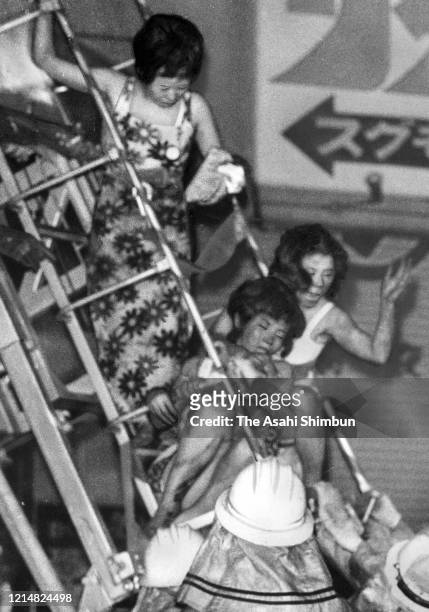 Hostesses evacuate from 7th floor, where a cabalet Play Town is located, at Sennichi Department Store fire on May 13, 1972 in Osaka, Japan. 118...