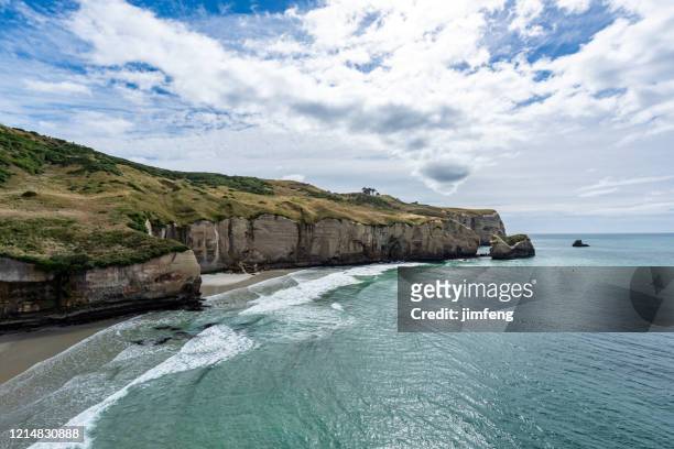 tunnel beach in south island of new zealand, dunedin, new zealand. - south stock pictures, royalty-free photos & images