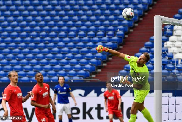 Andrea Luthe of Augsburg makes a save during the Bundesliga match between FC Schalke 04 and FC Augsburg at Veltins-Arena on May 24, 2020 in...