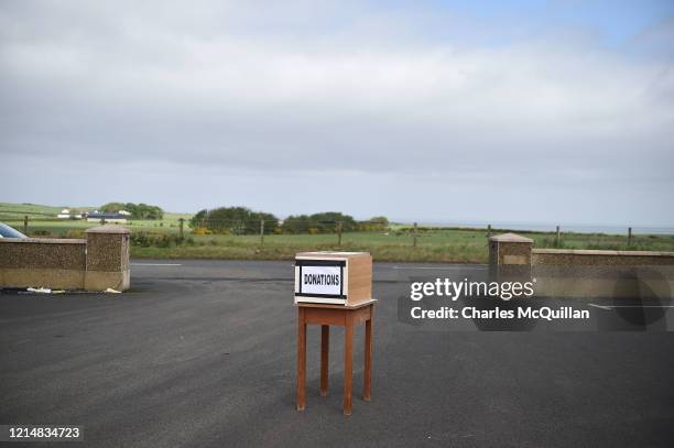 The donation box sits at the church entrance during a drive-in Sunday church service at Dunseverick Baptist Church on May 24, 2020 in Bushmills,...