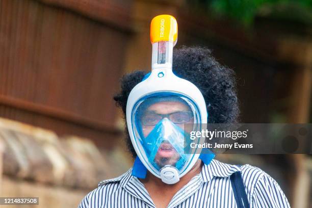 Person wearing a snorkel and mask is seen on March 26, 2020 in Sydney, Australia. Further restrictions on travel and movement have been put in to...