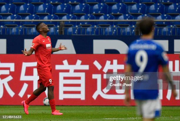 Sergio Cordova of Augsburg celebrates after scoring his team's third goal during the Bundesliga match between FC Schalke 04 and FC Augsburg at...