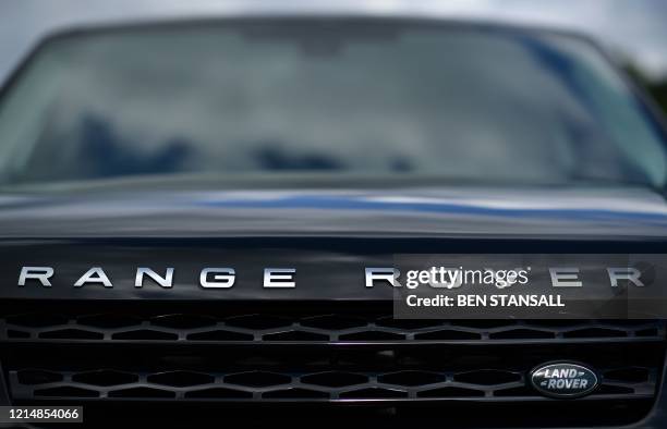 New Range Rover car is pictured on the forecourt of a Jaguar Land Rover new car show room in Tonbridge, south east England, on May 24, 2020. - Jaguar...