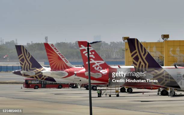 Planes are seen parked at Indira Gandhi International Airport, on May 24, 2020 in New Delhi, India. The flight services are resuming from Monday...