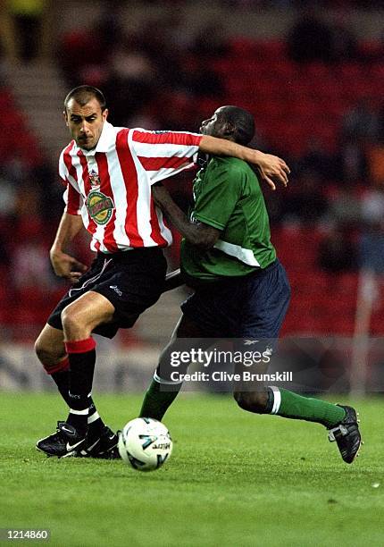 Djimi Traore of Liverpool in action against Daniel Dichio of Sunderland during the 100th League Championship Challenge match against Sunderland...