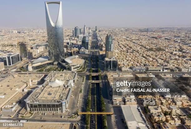 An aerial view shows the Kingdom Centre skyscraper and the King Fahad road, which remains empty due to the COVID-19 pandemic, on the first day of the...