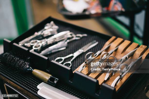 hairdresser comb and scissors on his equipment shelf, preparing for himself to work - hairdresser scissors stock pictures, royalty-free photos & images