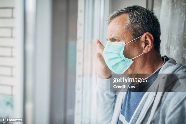 a man in isolation because of a virus - symptom stock pictures, royalty-free photos & images