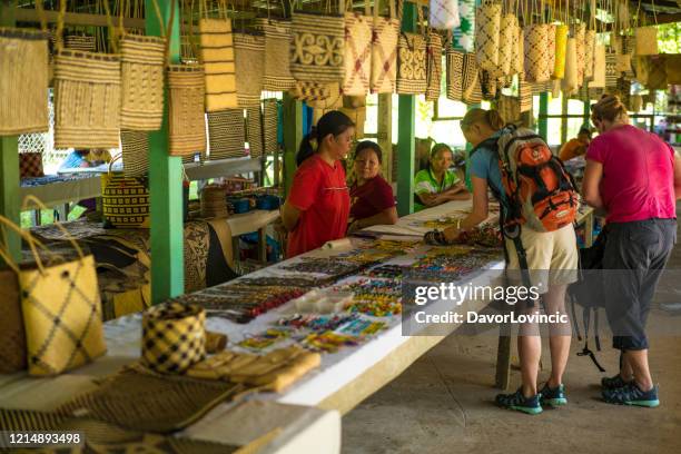 tourists at souvenir shop in local village gunung mulu national park, borneo - sarawak state stock pictures, royalty-free photos & images