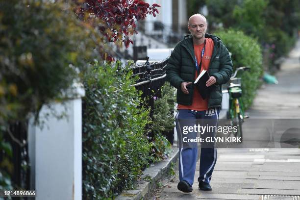 Number 10 Downing Street special advisor Dominic Cummings returns to his home in London on May 24, 2020 following allegations he broke coronavirus...