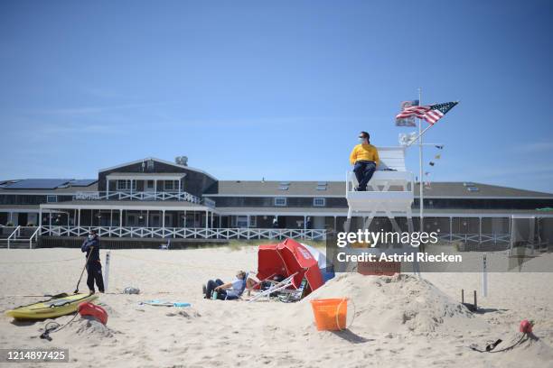 Life guards wear masks while guarding the East Hampton Main Beach during Memorial Day Weekend on May 24, 2020 in East Hampton, New York. Memorial Day...
