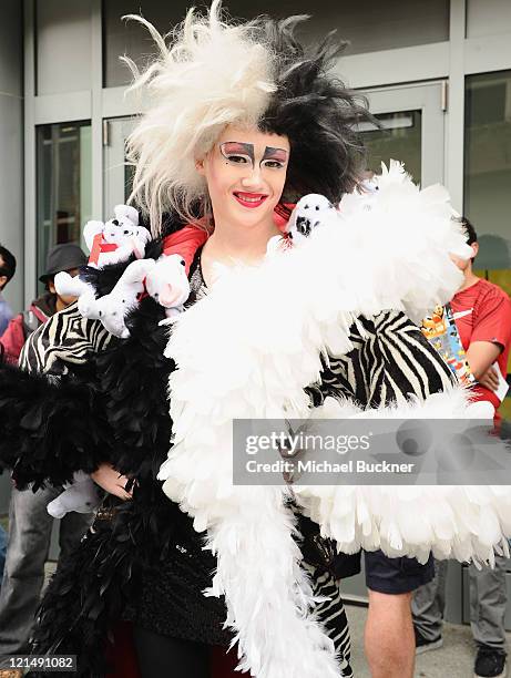 Blake Danford, a fan dressed as Cruella de Vil, attends Day One of Disney's D23 Expo 2011 at the Anaheim Convention Center on August 19, 2011 in...