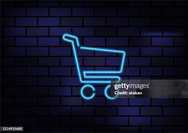 online-shopping-zeichen blau neon licht auf dunklen ziegelwand - shopping cart stock-grafiken, -clipart, -cartoons und -symbole