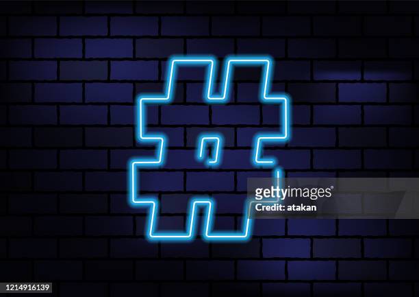 ilustrações de stock, clip art, desenhos animados e ícones de hashtag sign blue neon light on dark brick wall - hashtag