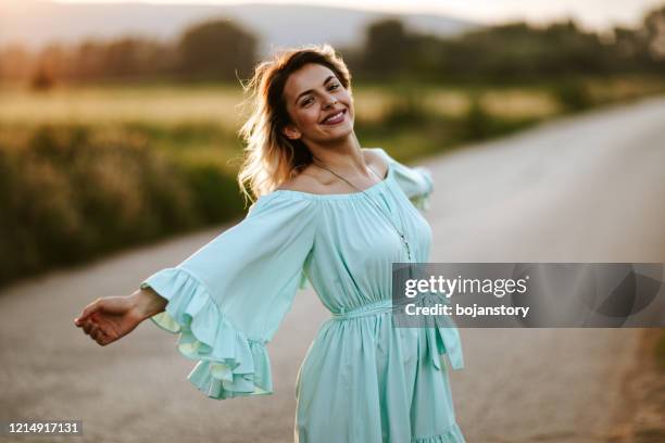 the most beautiful woman is a happy woman - green dress stock pictures, royalty-free photos & images