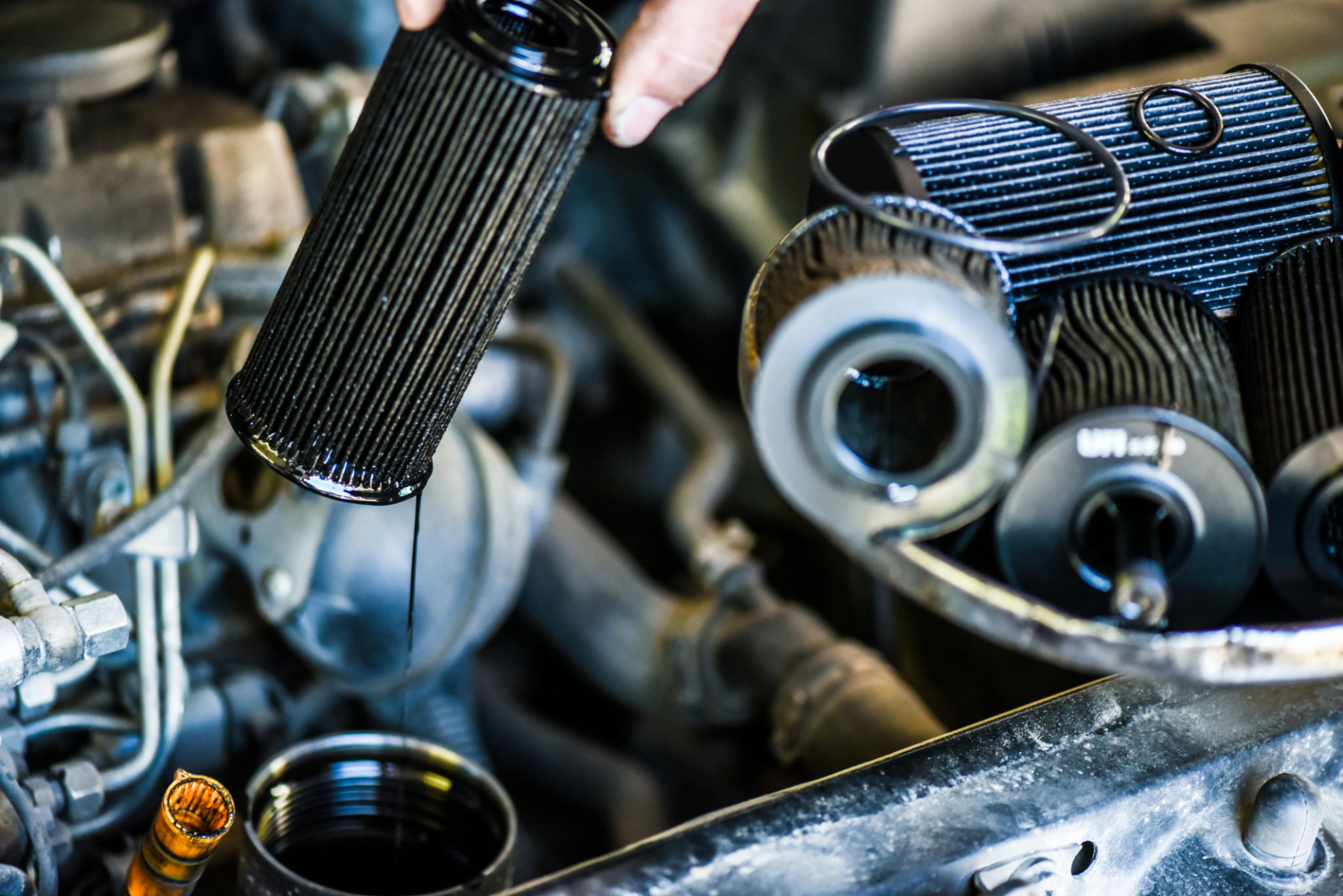 Close up of used car oil filters. Close up of used car oil filters.