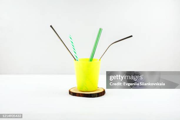 yellow reusable cup with different drinking straws. - metal drinking straw stock pictures, royalty-free photos & images