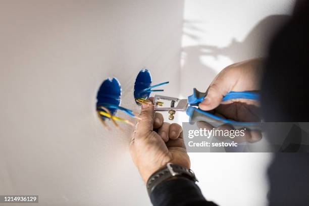 professional electrician job - electric imagens e fotografias de stock