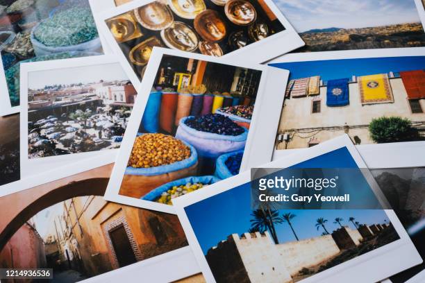 collection of instant travel holiday photos on a table - marrakech spice stockfoto's en -beelden