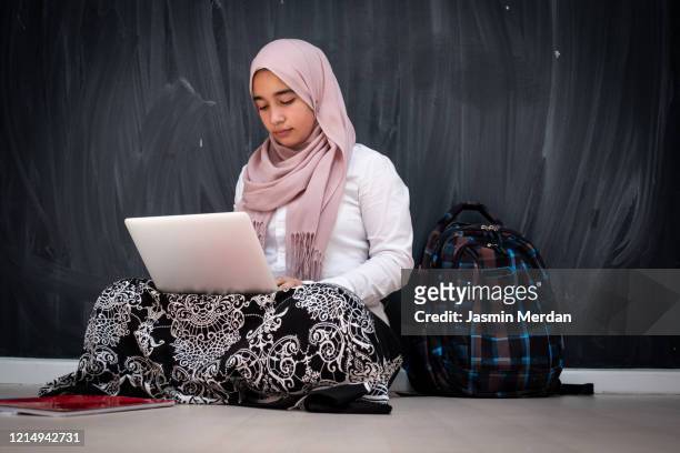 muslim female student with laptop in classroom - beautiful arabian girls stock pictures, royalty-free photos & images