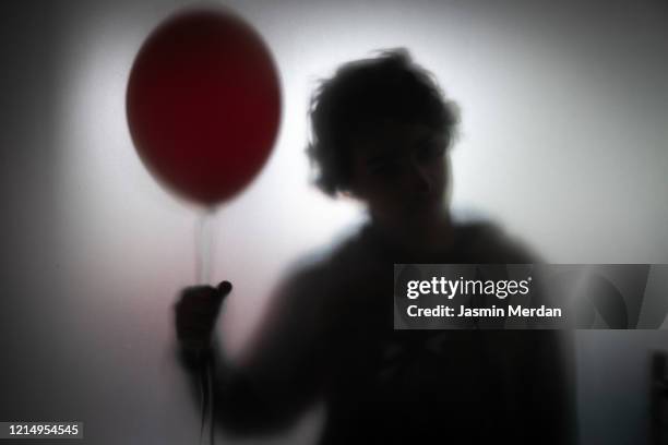 person behind glass spooky sillhouette - vandalismus haus stock-fotos und bilder