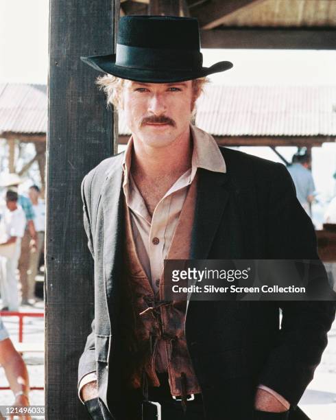 Robert Redford, US actor, in a Western costume, with a black cowboy hat and tan leather waistcoat, in a publicity portrait issued for the film,...