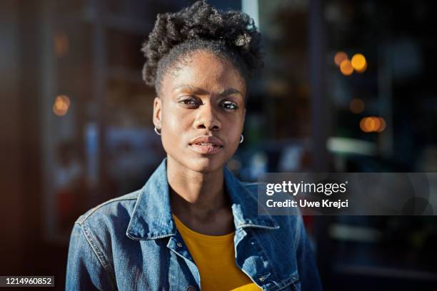 young woman outdoors - determined woman stock pictures, royalty-free photos & images