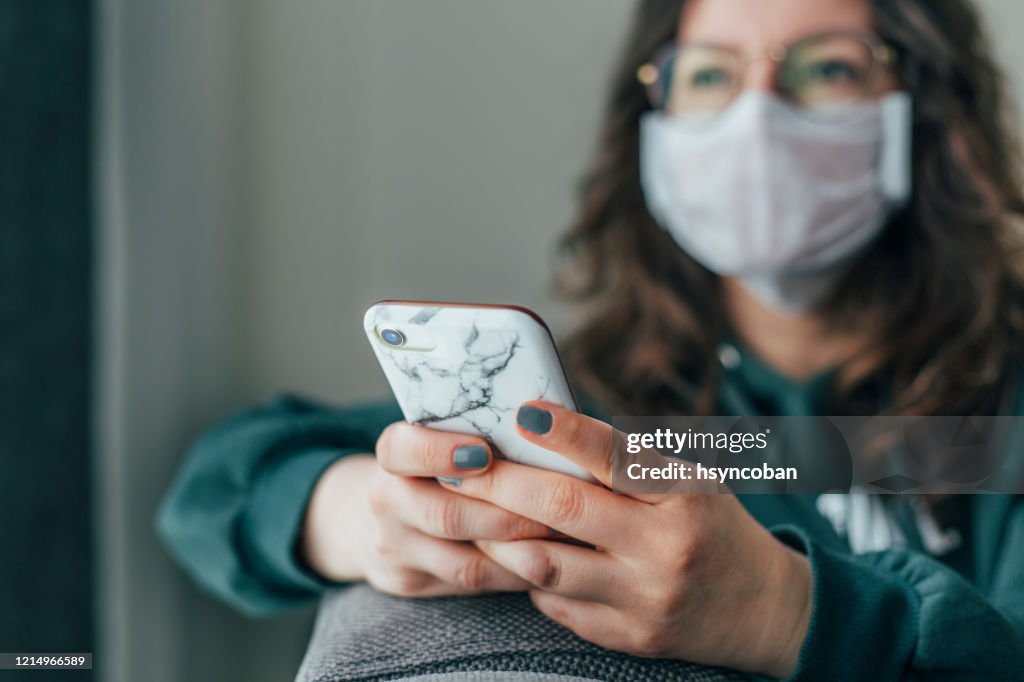 Worried Woman is Reading News on Phone