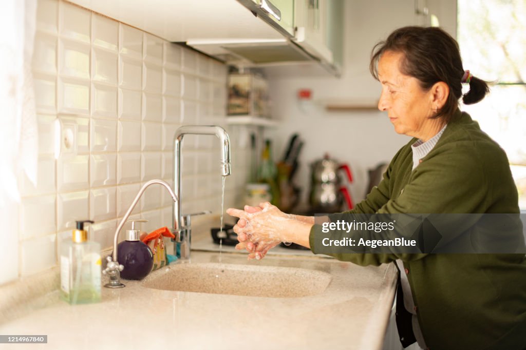 Old Woman Washing Her Hand