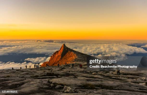 south peak ,mount kinabalu at sunrise viewed from the summit plateau - sabah state stock pictures, royalty-free photos & images