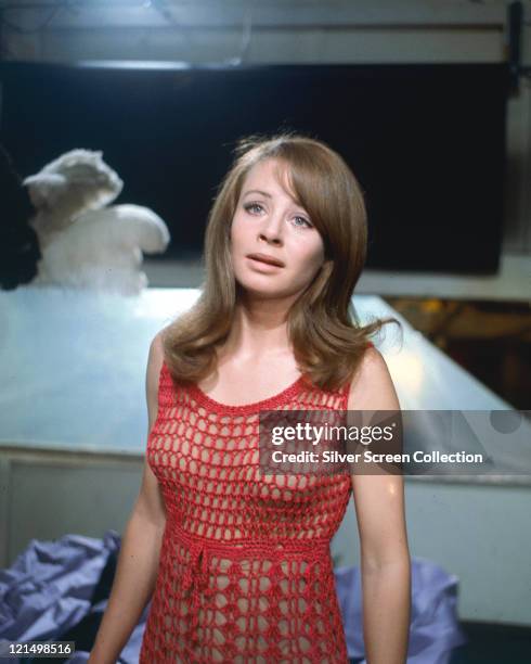 Sarah Miles, British actress, wearing a red macrame dress in a publicity still issued for the film, 'Blow-Up', United Kingdom, 1966. The thriller,...