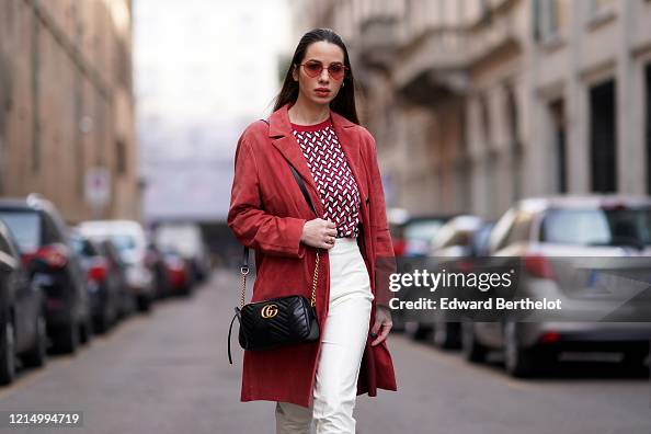 Mari Rizz Maria Rosaria Rizzo wears red heart shaped sunglasses, a red long ...