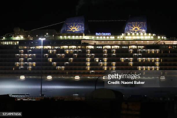 Ventura', a Grand-class cruise ship of the P&O Cruises fleet, docked at Southampton Docks shows its support for the NHS by lighting up rooms on the...