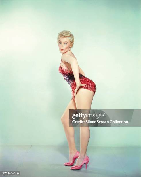 Sheree North , US actress, singer and dancer, wearing a showgirl costume in a studio portrait, circa 1955.