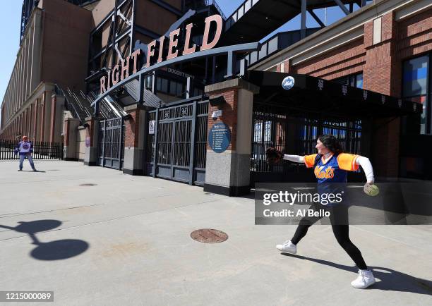 Father and daughter play catch outside the right field entrance of a closed Citi Field on the scheduled date for Opening Day on March 26, 2020 Citi...