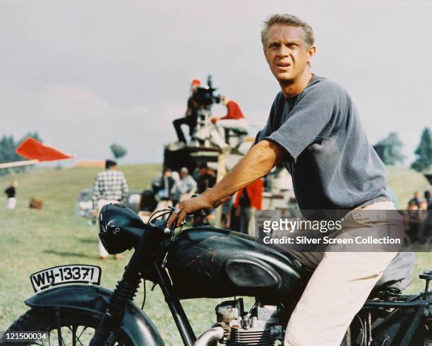 Steve McQueen , US actor, sitting astride a motorcycle in a publicity still issued for the film, 'The Great Escape', 1963. The prisoner of war drama,...