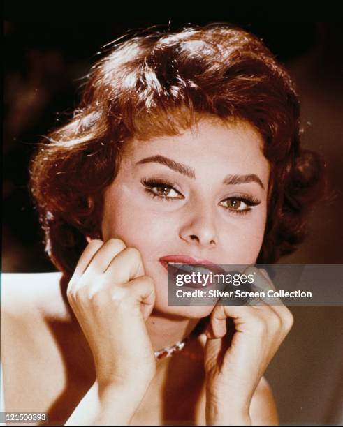 Headshot of Sophia Loren, Italian actress, with her chin resting on her hands, circa 1965.