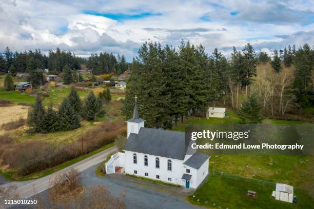 aerial view of a little white church in the san juan islands of the pacific northwest. - little chapel stock pictures, royalty-free photos & images