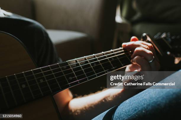 playing guitar - musical instrument foto e immagini stock