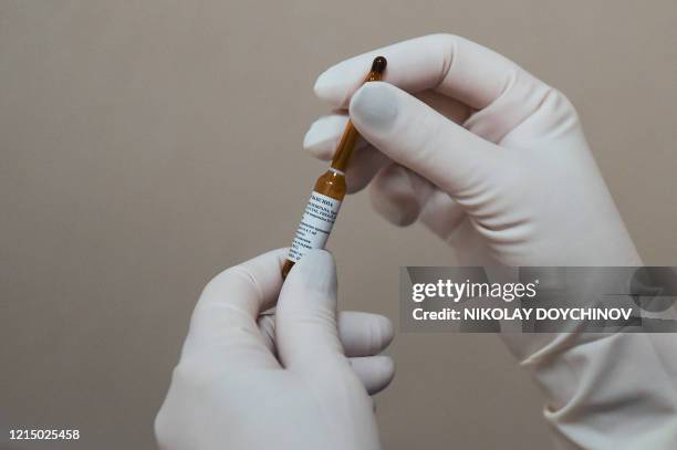 Neonatologist Valentina Gerginova holds a dose of BCG vaccine in Vita private hospital in Sofia on May 20, 20120. - As labs test if the traditional...