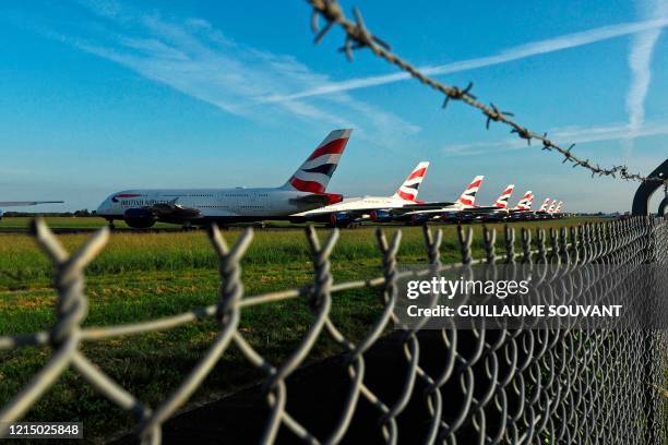 British Airways Airbus A380 aircrafts are parked at the Chateauroux-Deols "Marcel Dassault" Airport on May 22, 2020 in Deols, central France. - Many...