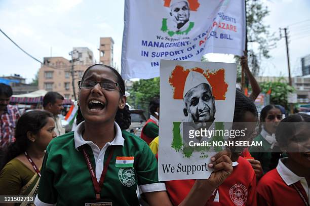 Indian schoolgirls participate in a rally to support Indian social activist Anna Hazare's fast, in Hyderabad on August 20, 2011. India's...