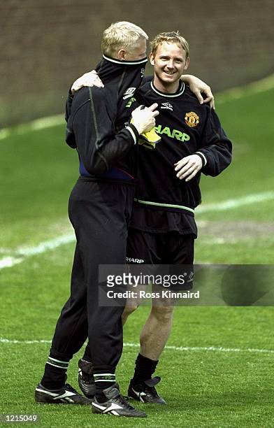 David May and Peter Schmeichel of Manchester United during training at the Cliff Training Ground in Manchester, England. \ Mandatory Credit: Ross...